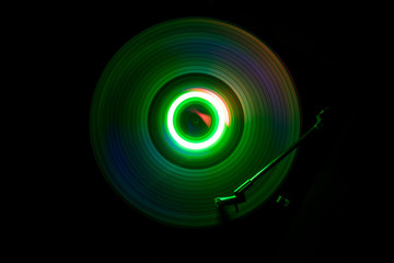 Concept of speed - Trail of fire and smoke - Vinyl record. Burning vinyl disk. Turntable vinyl record player. Retro audio equipment for disc jockey. Sound technology