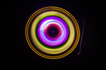 Concept of speed - Trail of fire and smoke - Vinyl record. Burning vinyl disk. Turntable vinyl record player. Retro audio equipment for disc jockey. Sound technology