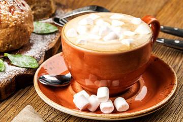 drink hot chocolate and marshmallows. marshmallows next to attributes.