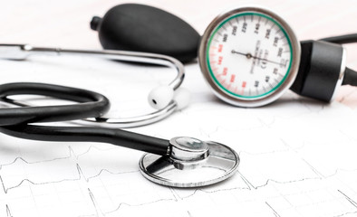 Stethoscope with manometer for measuring blood pressure on cardiogram.