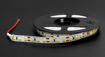 Coil with diode strip on black background.