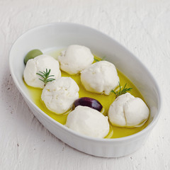 Labneh balls with olive oil and rosemary