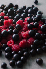 Bunch of fresh raspberries and black currants. Close-up view