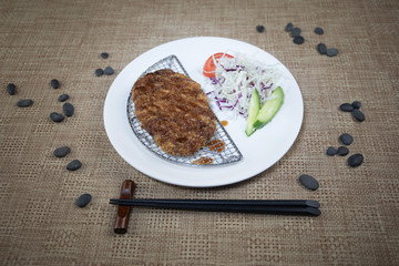 Close up view of plate with japanese food inside. Japan traditional food on wooden table.