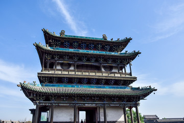 Obraz premium Ancient Chinese Architectural Gateway Wall under Clear Sky and White Cloud, Pingyao County,