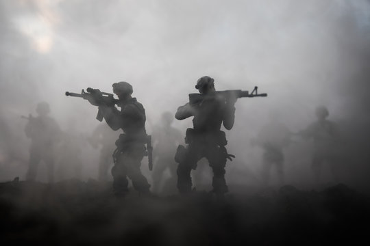 War Concept. Military silhouettes fighting scene on war fog sky background, World War Soldiers Silhouettes Below Cloudy Skyline At night. Attack scene. Armored vehicles. Tanks battle. Decoration