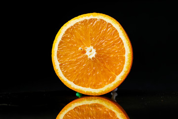 orange fruit black background