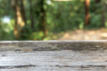 Fototapeta premium Empty Wooden table for your product and blur natural background, Wood table background nature montage