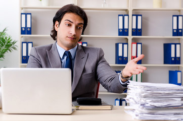 Fototapeta premium Leg injured employee working in the office 