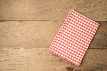 Empty wooden table with tablecloth. Top view from above