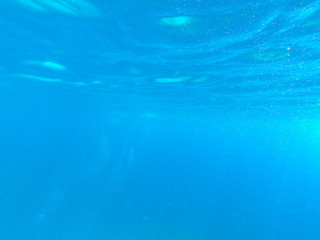 Beautiful texture of the sea and ocean water. blue background. Underwater photography. Red Sea, Egypt.