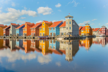 Fototapeta na wymiar Colourful scandinavian homes at Reitdiephaven in Groningen/ Netherlands. 
