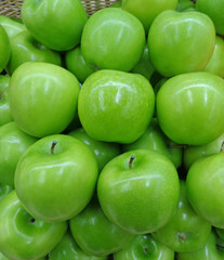 Vertical Image of Pile of Vibrant Color Fresh Green Apples 
