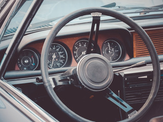 Close up image of an oldtimer car cockpit