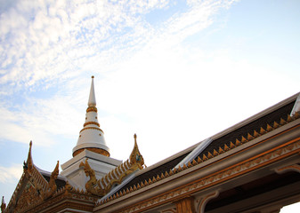Fototapeta premium temple in thailand and white pagoda under blue sky.