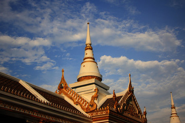Fototapeta premium temple in thailand with pagoda under blue sky.
