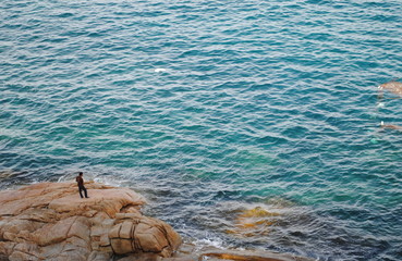 a man watching the ocean