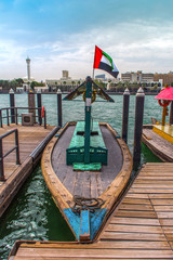 Traditional Boat Ride Abra Dubai Deira Creek, Place to visit in Dubai Blue Lake with flying UAE Flag