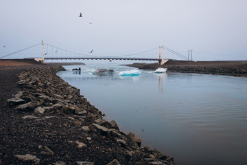 Blue glacier on the shores of the Atlantic Ocean. Iceberg in the ocean.