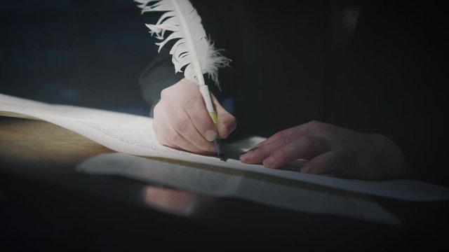Cinematic shot of the man writing a Torah scroll