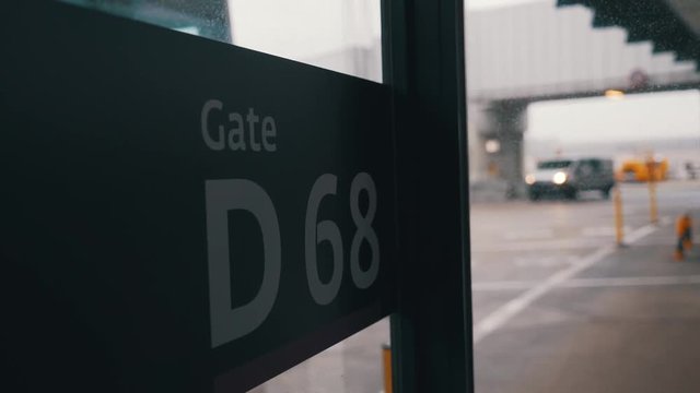 An airport gate sign close-up