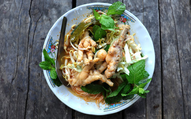 Top view of Thai noodles, delicious Thai vermicelli, eat with curry and fresh vegetables.