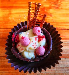 Handmade chocolate desserts with nuts and strawberries