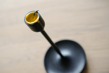 Burned yellow candles in the room