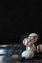 Fototapeta na wymiar raw eggs on a black background