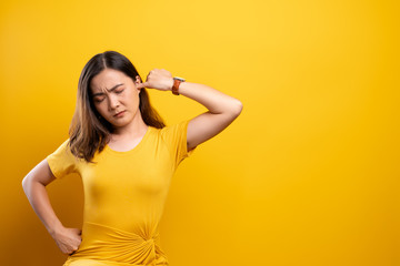 Woman putting a finger into her ear