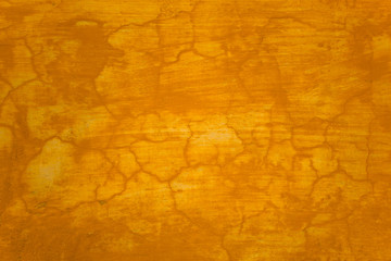 old shabby yellow wall with scratches and cracks. rough surface texture