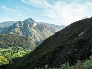 Mountain landscape,  a valley below the mountain slope