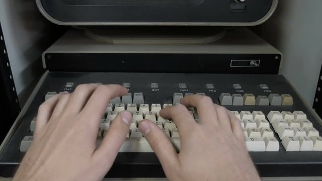 The Inserting 8 Inch Floppy Disk. Old-Style Computer 