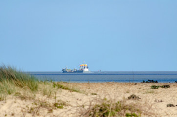 Cargo ship passing by Felixstowe shore