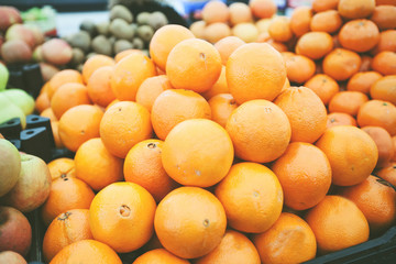 heap of oranges fruit at grocery store