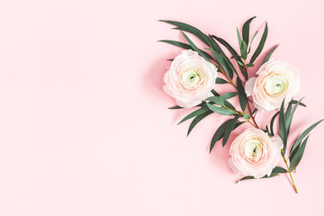 Flowers composition. Pink flowers and eucalyptus leaves on pastel pink background. Flat lay, top...