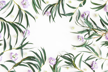 Flowers composition. Purple flowers and eucalyptus leaves on white background. Flat lay, top view, copy space