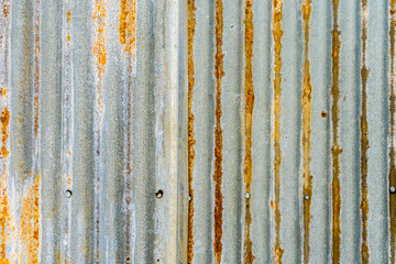 rusty metal distressed background. scratched profiled sheet. grunge old weathered backdrop. iron texture. copyspace concept