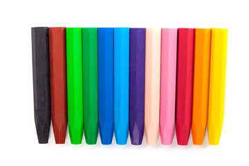 Group of crayons (pencils) stacked on white background