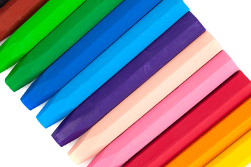 Group of crayons (pencils) stacked on white background