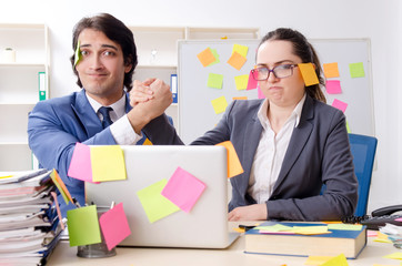 Two colleagues employees working in the office 