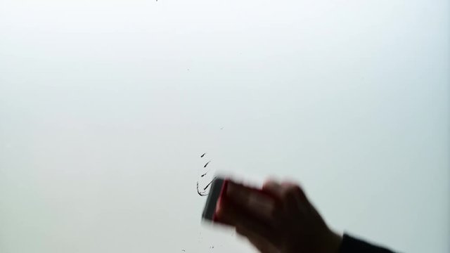 Businesswoman wipes question mark from whiteboard in business office