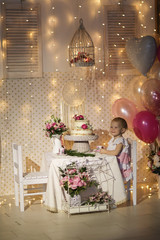 cake decorated with fresh flowers and girl child