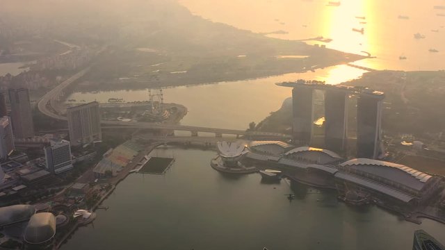 Drone Aerial view 4k Footage of the Marina Bay Sands in Singapore City Skyline. Sunrise
