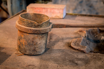 Metal pot use for melting other metals in a workshop