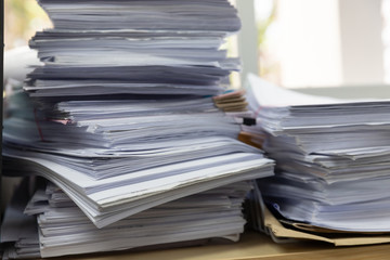 Business and finance concept of office working, Pile of unfinished documents on office desk, Stack of business paper