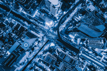 Aerial view of Sathorn intersection or junction with cars traffic, Bangkok Downtown, Thailand....