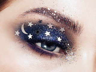 Eye makeup woman with decorative stars. Perfect makeup. Beauty fashion. False Eyelashes. Cosmetic...