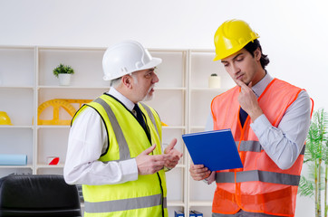 Two engineers colleagues working under project 