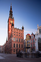 Obraz premium Morning in Gdansk, Poland. City Hall of Main Town on Dulga street. 2 March, 2019